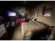 A bedroom with a bed, multiple TVs, and numerous wall decorations at 618 Douglas St, Shelby, NC 28150