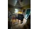 Kitchen view with a table and chairs, cabinets, and visible ceiling damage at 618 Douglas St, Shelby, NC 28150