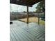 Wooden patio deck with a fire pit, string lights, backyard and playground view at 664 Cape Fear St, Fort Mill, SC 29715