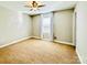 Spacious bedroom with plush carpet, a ceiling fan, and a large window with curtains at 664 Cape Fear St, Fort Mill, SC 29715