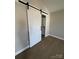 Bedroom with a white barn door leading to a bathroom at 664 Cape Fear St, Fort Mill, SC 29715