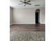 Spacious bedroom boasts stylish flooring, a ceiling fan, and an arched doorway to an ensuite bathroom at 664 Cape Fear St, Fort Mill, SC 29715