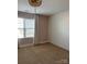 Bedroom featuring neutral carpet, a beaded chandelier, and ship lap accent wall at 664 Cape Fear St, Fort Mill, SC 29715