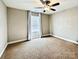 Cozy bedroom featuring neutral walls, carpet, and a ceiling fan with a window and blinds at 664 Cape Fear St, Fort Mill, SC 29715