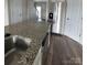 Open-concept kitchen island with granite countertops, stainless steel appliances, and stylish flooring at 664 Cape Fear St, Fort Mill, SC 29715