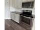 Well-lit kitchen with stainless steel oven and microwave, light colored cabinets, and granite countertops at 664 Cape Fear St, Fort Mill, SC 29715