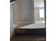 Top of carpeted stairway leading to large room with window at 664 Cape Fear St, Fort Mill, SC 29715