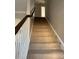 Carpeted staircase with white wooden railing at 664 Cape Fear St, Fort Mill, SC 29715