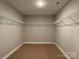 Large walk-in closet with carpet flooring and extensive shelving at 664 Cape Fear St, Fort Mill, SC 29715