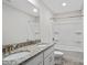 Bright bathroom featuring a double vanity with granite countertop and modern fixtures at 687 Cape Fear St, Fort Mill, SC 29715