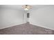 Cozy bedroom features a neutral walls, plush carpet, and ceiling fan, creating a peaceful retreat at 687 Cape Fear St, Fort Mill, SC 29715