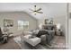 Staged bedroom features a ceiling fan, a large window, and tasteful decor, creating a peaceful retreat at 687 Cape Fear St, Fort Mill, SC 29715