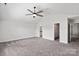 Spacious bedroom with neutral walls, carpet, and ceiling fan, ready to be personalized as your sanctuary at 687 Cape Fear St, Fort Mill, SC 29715