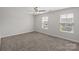 Bright bedroom featuring a neutral walls, plush carpet, and large windows, creating a comfortable retreat at 687 Cape Fear St, Fort Mill, SC 29715