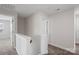 Bright hallway features neutral walls and plush carpeting, creating a seamless transition between rooms at 687 Cape Fear St, Fort Mill, SC 29715