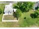 This aerial view showcases the backyard, landscaping, and the home's position on the lot at 711 Wood St, Albemarle, NC 28001