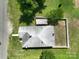 Aerial view showcasing the home's roof, fenced backyard, and surrounding greenery at 711 Wood St, Albemarle, NC 28001