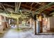 This basement features exposed ductwork and a water heater at 711 Wood St, Albemarle, NC 28001