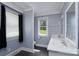 Bathroom featuring a double sink vanity and natural light at 711 Wood St, Albemarle, NC 28001