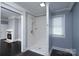 Bathroom featuring a tiled shower and natural light at 711 Wood St, Albemarle, NC 28001