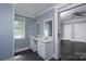 Bathroom featuring a double sink vanity and natural light at 711 Wood St, Albemarle, NC 28001