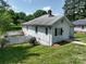 This home features a charming exterior with a white picket fence and well-maintained lawn at 711 Wood St, Albemarle, NC 28001