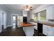 Bright kitchen featuring a central island cooktop, and modern appliances at 711 Wood St, Albemarle, NC 28001