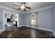Cozy living room with hardwood floors open to kitchen, and a window at 711 Wood St, Albemarle, NC 28001