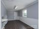 A flex room with wood look flooring and a utility sink at 711 Wood St, Albemarle, NC 28001
