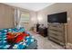 This cozy bedroom features a comfortable bed and carpeted floors at 7977 Shady Oak Trl, Charlotte, NC 28210