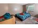 This bedroom is carpeted and has a blue comforter on the bed at 7977 Shady Oak Trl, Charlotte, NC 28210
