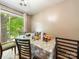 Bright dining area with natural light, a large window, and space for entertaining at 7977 Shady Oak Trl, Charlotte, NC 28210