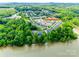 Aerial view of townhome community situated near a tranquil lake at 809 River Park Rd, Belmont, NC 28012