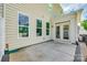 Backyard patio with vinyl siding and well-maintained landscaping with an entrance to the home at 809 River Park Rd, Belmont, NC 28012