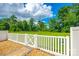 Backyard area features a white fence and lush greenery at 809 River Park Rd, Belmont, NC 28012