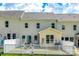 Back exterior view features white fence and patio furniture at 809 River Park Rd, Belmont, NC 28012