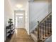 Bright foyer with hardwood floors, staircase, and front door at 809 River Park Rd, Belmont, NC 28012