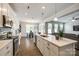 Bright kitchen featuring a spacious island, stainless steel appliances, and hardwood floors at 809 River Park Rd, Belmont, NC 28012