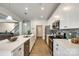 Modern kitchen with stainless steel appliances, white cabinetry, and a large island at 809 River Park Rd, Belmont, NC 28012