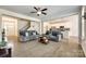 Open-concept living room connected to a modern kitchen with sleek appliances at 809 River Park Rd, Belmont, NC 28012
