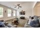 Cozy living room with a ceiling fan, hardwood floors, and neutral paint at 809 River Park Rd, Belmont, NC 28012