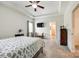 Spacious bedroom featuring carpeted floors, a tray ceiling, and a door to the en suite bathroom at 809 River Park Rd, Belmont, NC 28012