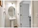 Clean powder room with a pedestal sink and neutral tones at 809 River Park Rd, Belmont, NC 28012