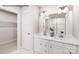 Modern bathroom featuring double sinks, white cabinetry, and a glass-enclosed shower, offering a clean design at 964 Pemberley St # 3193, Lancaster, SC 29720