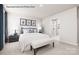 Comfortable bedroom with a queen-sized bed, stylish linens, and an ensuite bathroom with a glass-enclosed shower at 964 Pemberley St # 3193, Lancaster, SC 29720