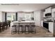 Bright kitchen with white cabinets, a large island with bar stool seating, and stainless steel appliances at 964 Pemberley St # 3193, Lancaster, SC 29720
