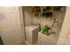 Well-equipped laundry room with washer, dryer, and shelving for storage, creating a convenient space at 1062 Piney Church Rd, Concord, NC 28025