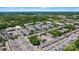 Scenic aerial view of 110 Dime Lane, a charming neighborhood with mature trees, businesses, and manicured landscaping at 110 Dime Ln, Mooresville, NC 28117