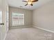 Spacious bedroom with natural light, carpet flooring, and ample closet space at 110 Dime Ln, Mooresville, NC 28117