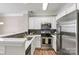 Modern kitchen with stainless steel appliances and stylish backsplash at 110 Dime Ln, Mooresville, NC 28117